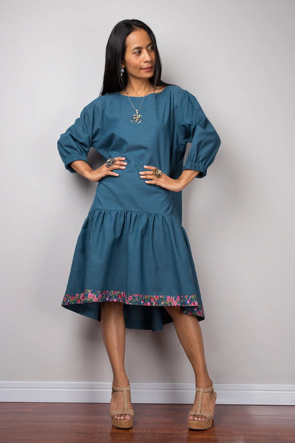 Midi dress with sleeves and floral detail